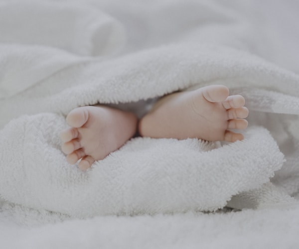 Parent holding newborn baby